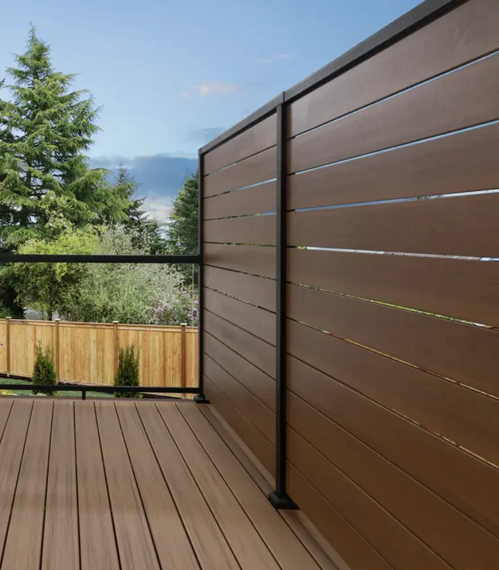 Composite privacy screen boards in a powder-coated aluminum frame on a composite deck