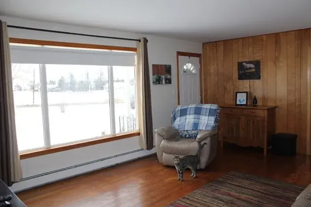 Before, Living and Dining Opened into One Room in Red Deer, AB, by Green Ladder Contractors