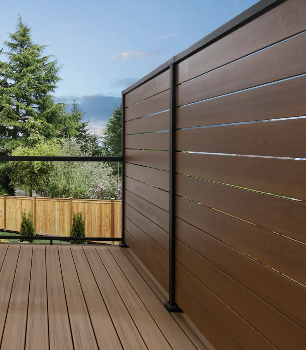 Composite privacy screen boards in a powder-coated aluminum frame on a composite deck